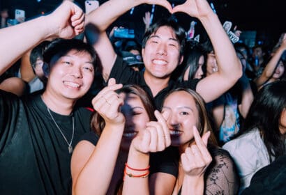 Guests smiling and heart sign