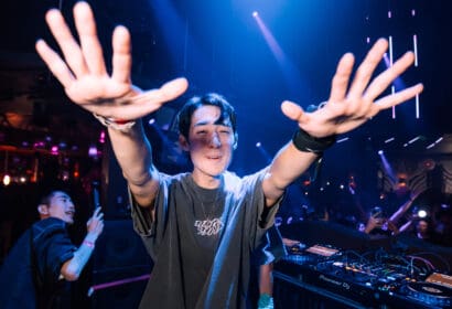 DJ with hands up at Time Nightclub