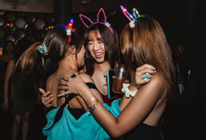 Guests posing with giveaways at Flashback at Time Nightclub