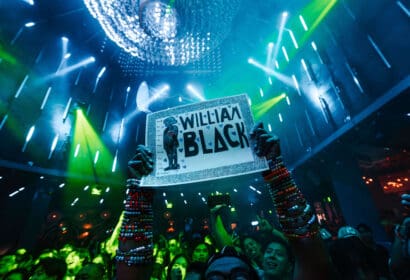 Attendee holding sign t William Black at Time Nightclub in Orange County Nightclub