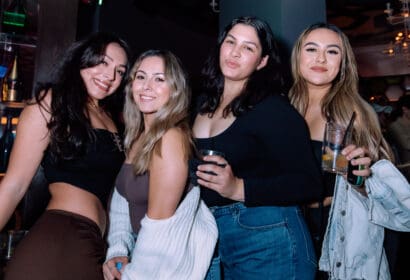 Guests posing at Time Machine at Time Nightclub in Costa Mesa, CA