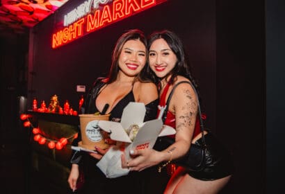 Guests posing at Henry Fong's Night Market at Time Nightclub in Costs Mesa, CA