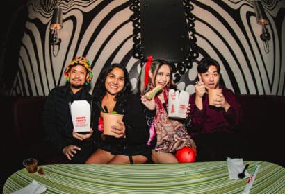 Guests posing at Henry Fong's Night Market at Time Nightclub in Costs Mesa, CA