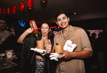 Guests posing at Henry Fong's Night Market at Time Nightclub in Costs Mesa, CA