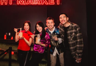 Guests posing at Henry Fong's Night Market at Time Nightclub in Costs Mesa, CA