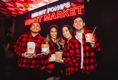 Guests posing at Henry Fong's Night Market at Time Nightclub in Costs Mesa, CA