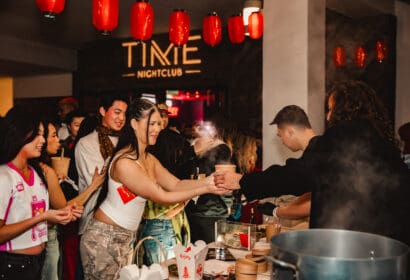 Guests posing at Henry Fong's Night Market at Time Nightclub in Costs Mesa, CA