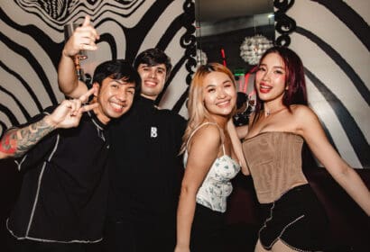 Guests posing at Henry Fong's Night Market at Time Nightclub in Costs Mesa, CA