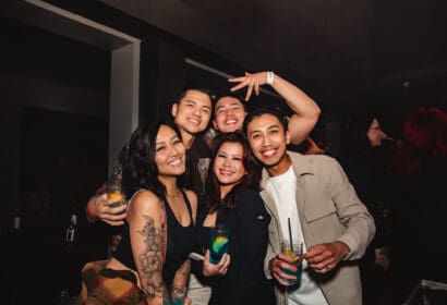 Guests posing at Henry Fong's Night Market at Time Nightclub in Costs Mesa, CA