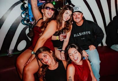 Guests posing at AC Slater at Time Nightclub in Costa Mesa, CA