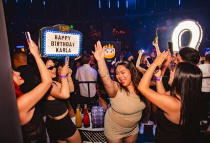 Guests posing at Mike Sherm at Time Nightclub in Costa Mesa, CA
