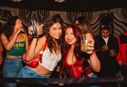 Guests posing at Mike Sherm at Time Nightclub in Costa Mesa, CA