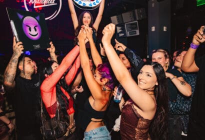 Guests posing at Mike Sherm at Time Nightclub in Costa Mesa, CA