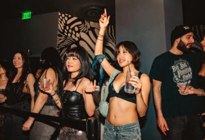 Guests posing at Mike Sherm at Time Nightclub in Costa Mesa, CA