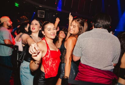 Guests posing at Mike Sherm at Time Nightclub in Costa Mesa, CA