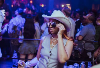 Guests posing at Leon Thomas at Time Nightclub in Costa Mesa, CA