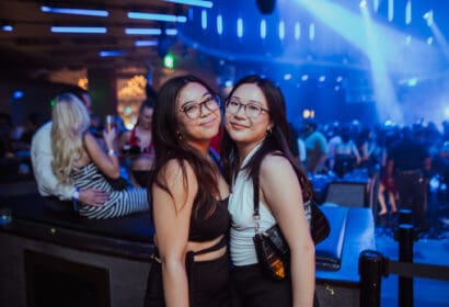Guests posing at Leon Thomas at Time Nightclub in Costa Mesa, CA