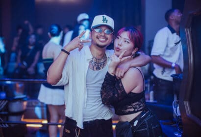 Guests posing at Leon Thomas at Time Nightclub in Costa Mesa, CA