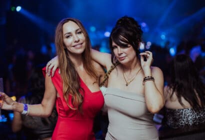 Guests posing at Leon Thomas at Time Nightclub in Costa Mesa, CA